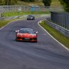 high speed car racing on a scenic track